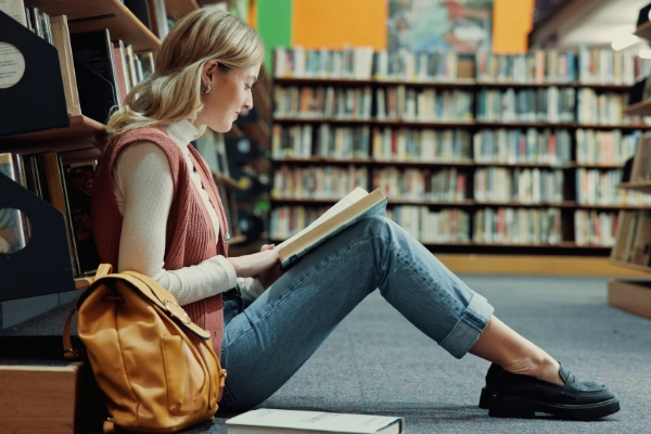 Student Reading At Library 600X400